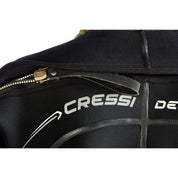 Close-up of a black wetsuit with Cressi branding on a white background