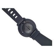 Black dive computer watch with a strap on a white background
