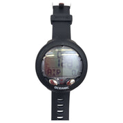 Black diving computer watch with digital display on a white background