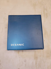 Blue box with 'OCEANIC'branding on a beige surface