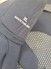 Gray protective pad with 'XL'and 'Made in Thailand'text on a textured surface